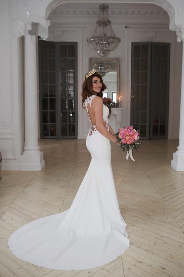 Impresionante vestido de novia de sirena sin mangas con encaje y botones con cremallera