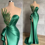 Abito da sera verde smeraldo lungo a sirena lucido senza maniche con perline