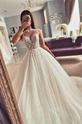 Abito da sposa vintage in tulle con maniche lunghe in pizzo a linea ad A